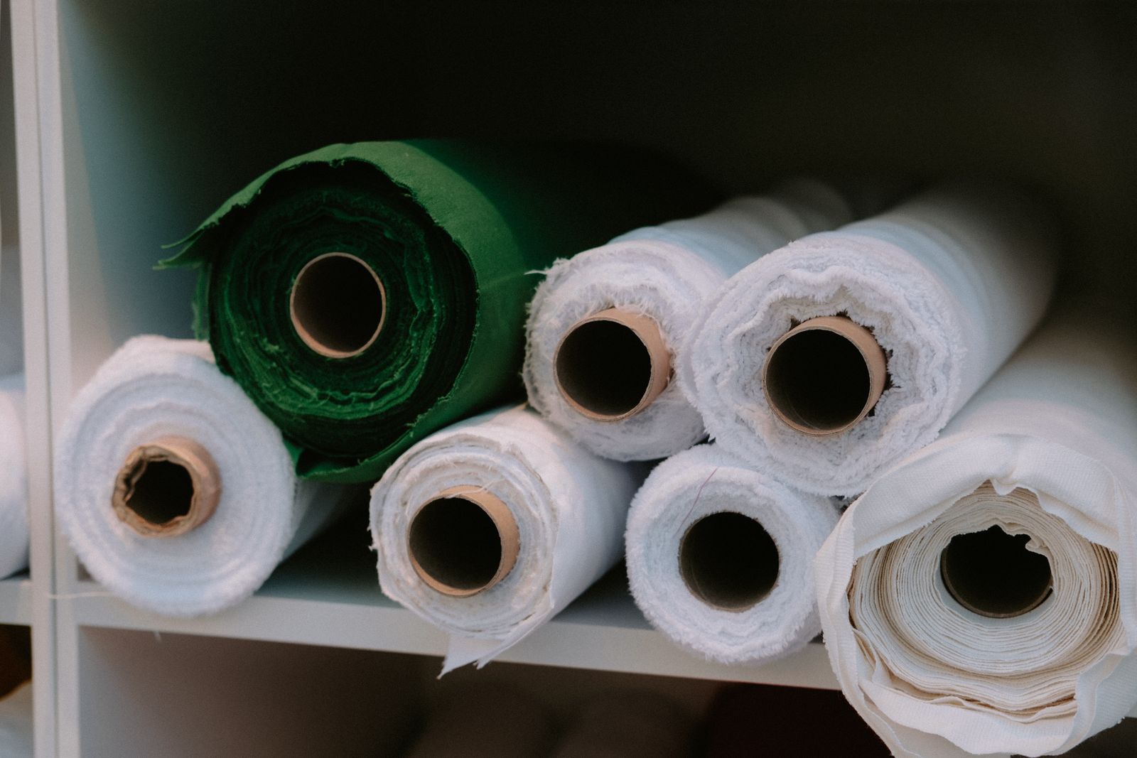 Commercial fabric rolls used to illustrate wholesale yardage.