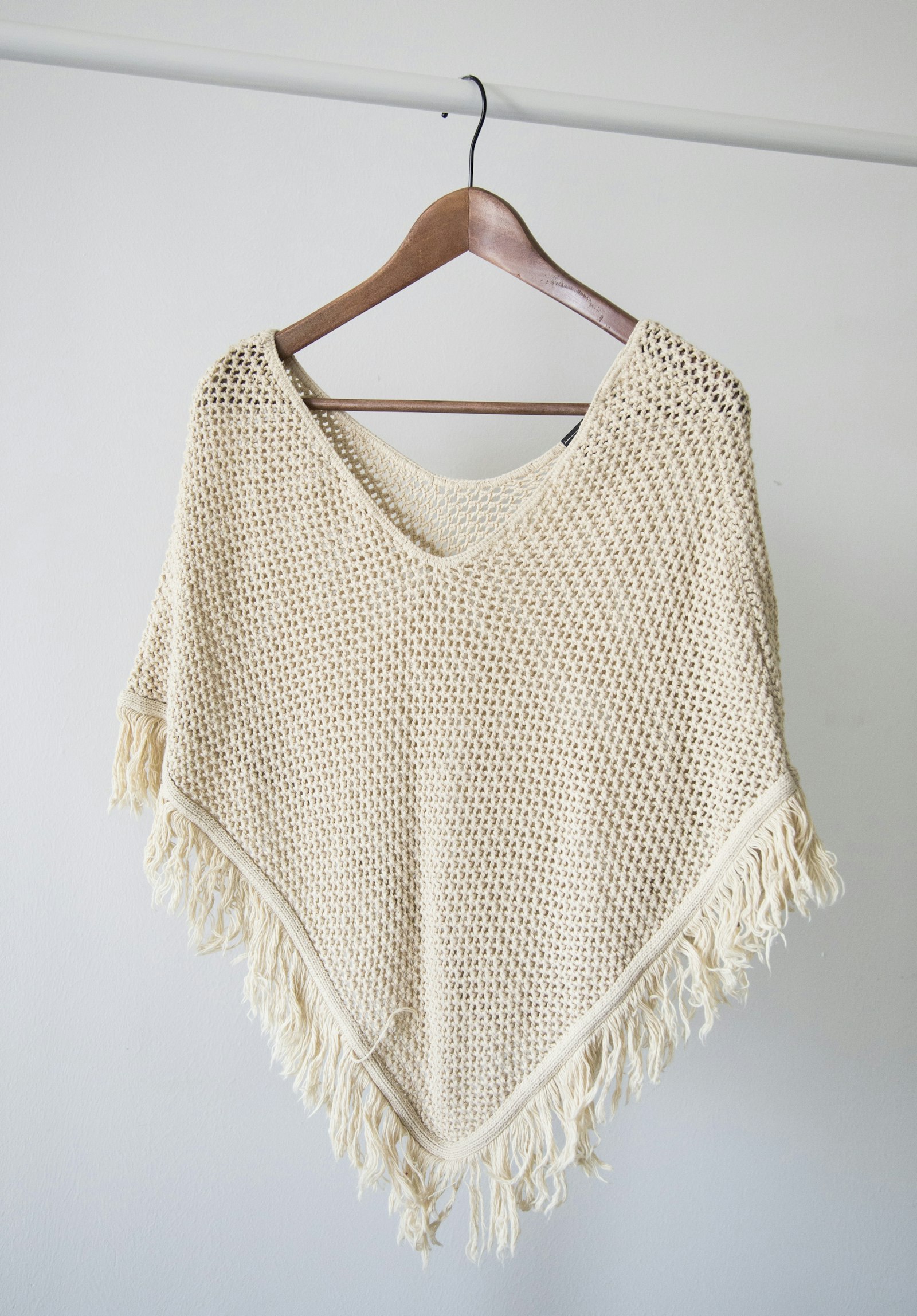 Open-stitch knit garment used to illustrate knit structure and drape.